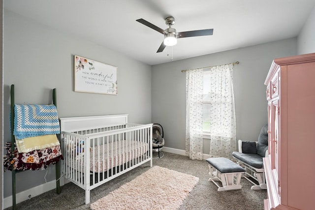925 8th St, Tuscola, TX 79562 - bedroom featuring carpet flooring, a nursery area, baseboards, and a ceiling fan
