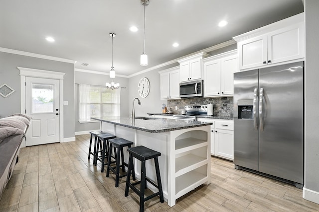 925 8th St, Tuscola, TX 79562 - kitchen with appliances with stainless steel finishes, a sink, tasteful backsplash, open shelves, and crown molding
