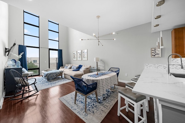 2608 Museum Way Unit 3417, Fort Worth, TX 76107 - living area with plenty of natural light, high vaulted ceiling, dark wood finished floors, and a chandelier