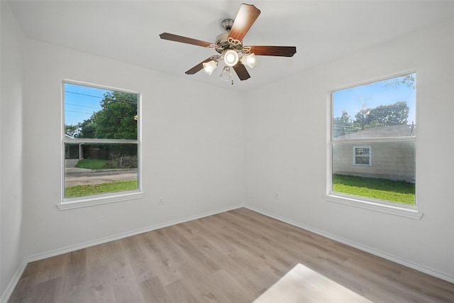 714 E 12th St, Bonham, TX 75418 - unfurnished room with wood finished floors, baseboards, and ceiling fan