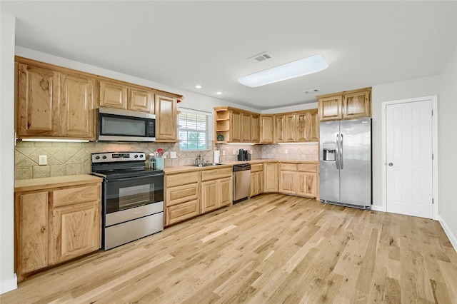 11605 Fm 697, Whitewright, TX 75491 - kitchen with stainless steel appliances, light wood-type flooring, open shelves, light countertops, and recessed lighting