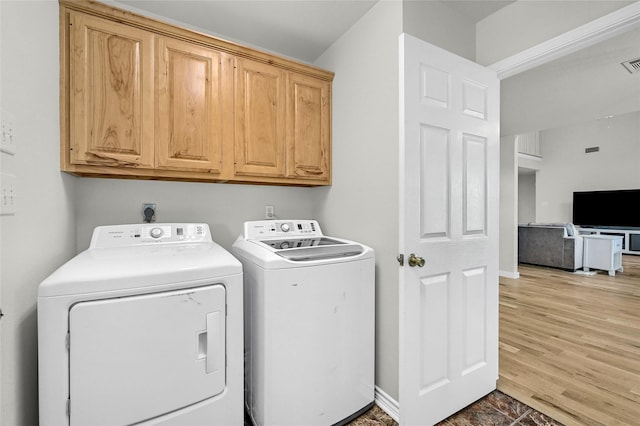 11605 Fm 697, Whitewright, TX 75491 - laundry room featuring independent washer and dryer, cabinet space, and baseboards