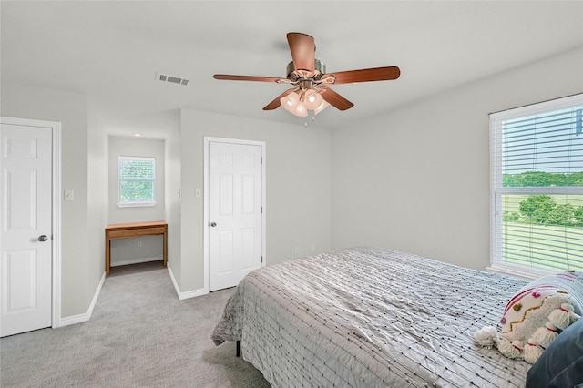 11605 Fm 697, Whitewright, TX 75491 - bedroom with light carpet, baseboards, and a ceiling fan