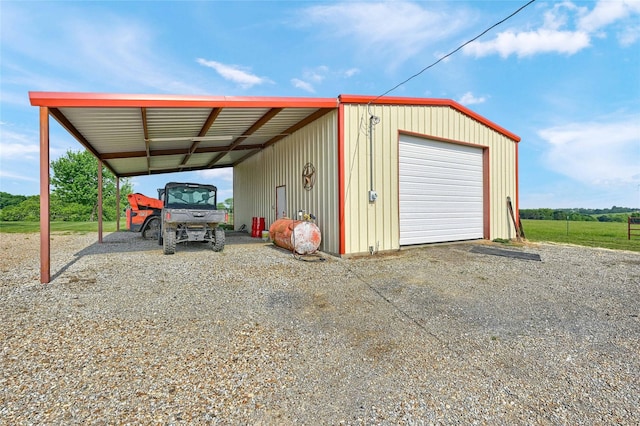 11605 Fm 697, Whitewright, TX 75491 - garage featuring a detached garage and gravel driveway