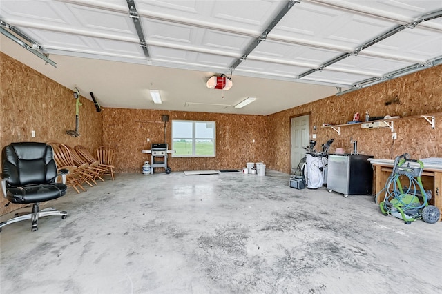 11605 Fm 697, Whitewright, TX 75491 - garage featuring a garage door opener and refrigerator