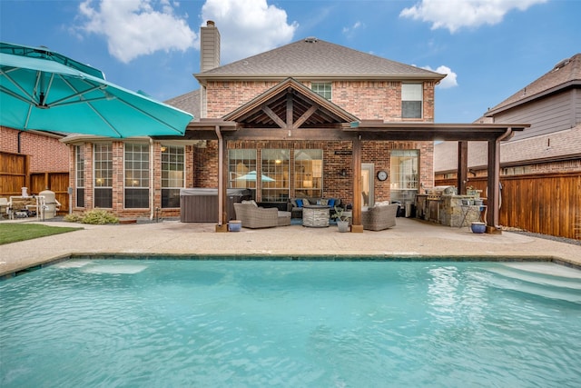 8230 Carter St, Lantana, TX 76226 - view of swimming pool featuring a patio, exterior kitchen, and an outdoor hangout area
