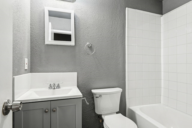 1509 Cedar Keys Dr, Lewisville, TX 75067 - full bathroom with a textured wall, toilet, vanity, and bathtub / shower combination