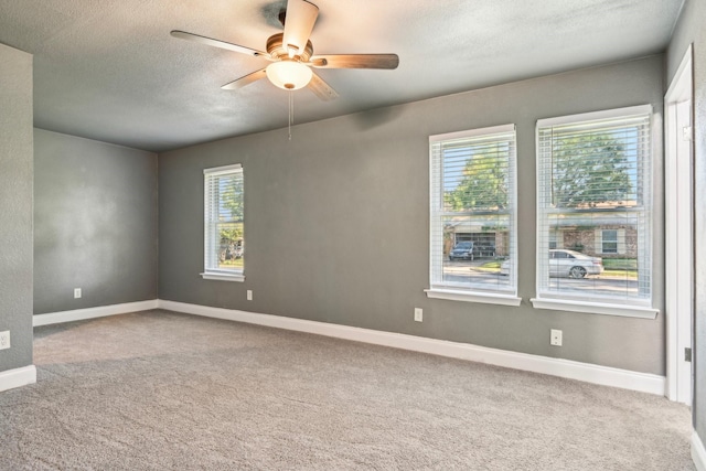 1509 Cedar Keys Dr, Lewisville, TX 75067 - carpeted empty room with ceiling fan, a textured ceiling, and baseboards