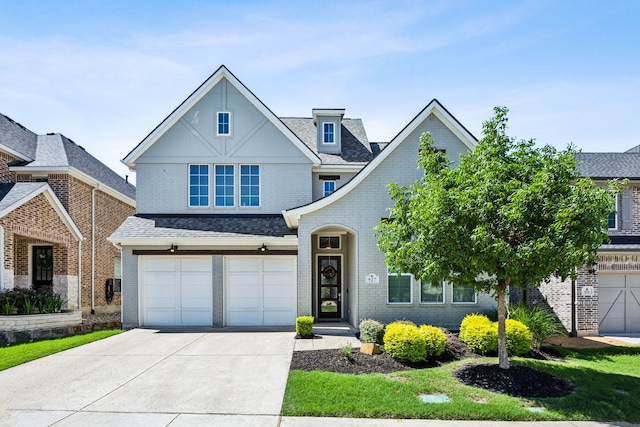 927 Leola Ln, Allen, TX 75013 - view of front facade featuring concrete driveway, an attached garage, and brick siding