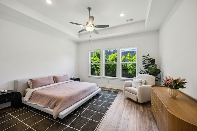 927 Leola Ln, Allen, TX 75013 - bedroom featuring a tray ceiling, wood finished floors, recessed lighting, baseboards, and ceiling fan