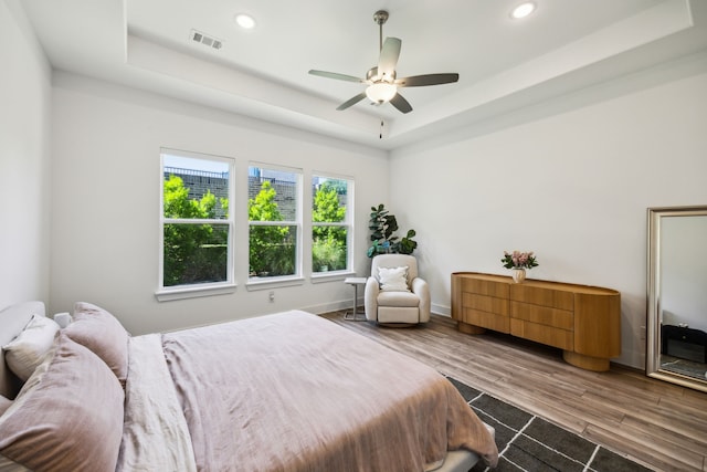 927 Leola Ln, Allen, TX 75013 - bedroom featuring a raised ceiling, wood finished floors, recessed lighting, baseboards, and a ceiling fan