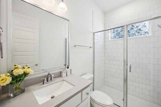 927 Leola Ln, Allen, TX 75013 - bathroom featuring vanity, toilet, and a stall shower