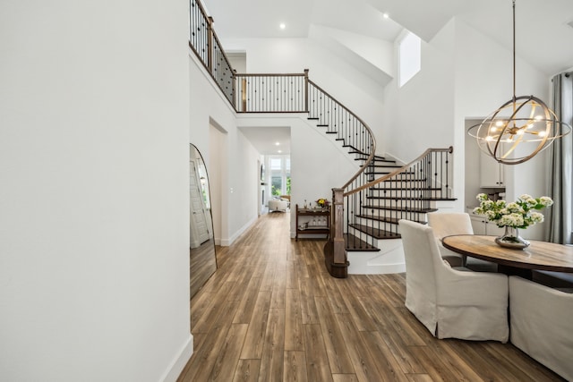 927 Leola Ln, Allen, TX 75013 - entrance foyer with a towering ceiling, stairway, a chandelier, and wood finished floors