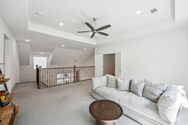 927 Leola Ln, Allen, TX 75013 - carpeted living room with a ceiling fan, a raised ceiling, and recessed lighting