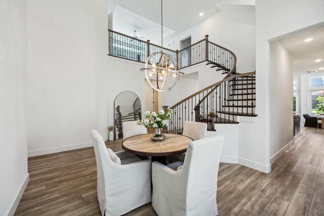 927 Leola Ln, Allen, TX 75013 - dining space featuring wood finished floors, stairway, a chandelier, baseboards, and a high ceiling