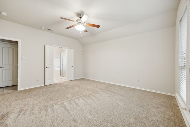 912 Kittery Dr, Desoto, TX 75115 - unfurnished bedroom with light carpet, baseboards, ensuite bathroom, ceiling fan, and lofted ceiling