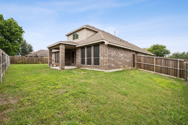 912 Kittery Dr, Desoto, TX 75115 - rear view of property with brick siding and a patio area