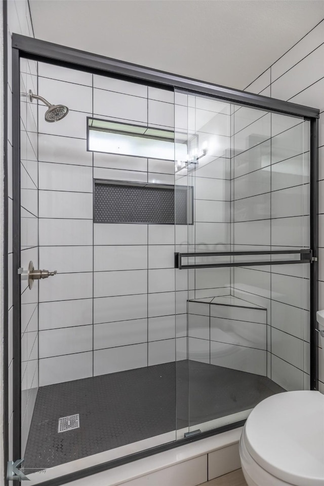 1518 Weavers Way, Abilene, TX 79602 - bathroom with a shower stall and toilet