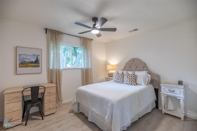 1518 Weavers Way, Abilene, TX 79602 - bedroom with light wood finished floors, a ceiling fan, and baseboards