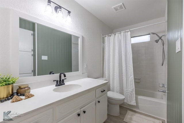 1518 Weavers Way, Abilene, TX 79602 - full bathroom featuring toilet, vanity, shower / tub combo with curtain, wood finished floors, and a textured wall