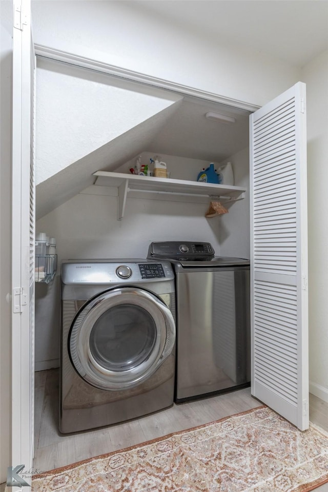 1518 Weavers Way, Abilene, TX 79602 - laundry room featuring washer and clothes dryer and wood finished floors