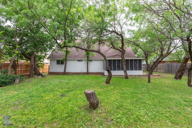 1518 Weavers Way, Abilene, TX 79602 - back of house featuring a sunroom and roof with shingles