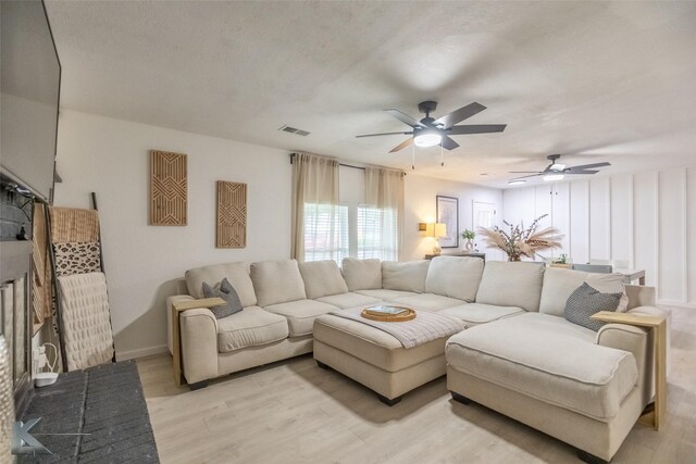 1518 Weavers Way, Abilene, TX 79602 - living room with a ceiling fan, light wood-type flooring, and baseboards