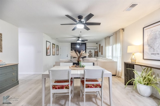 1518 Weavers Way, Abilene, TX 79602 - dining area with ceiling fan, light wood-type flooring, and baseboards