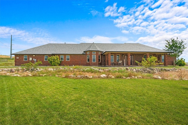 1114 Mount Ln, Rhome, TX 76078 - view of front facade featuring a front yard and brick siding
