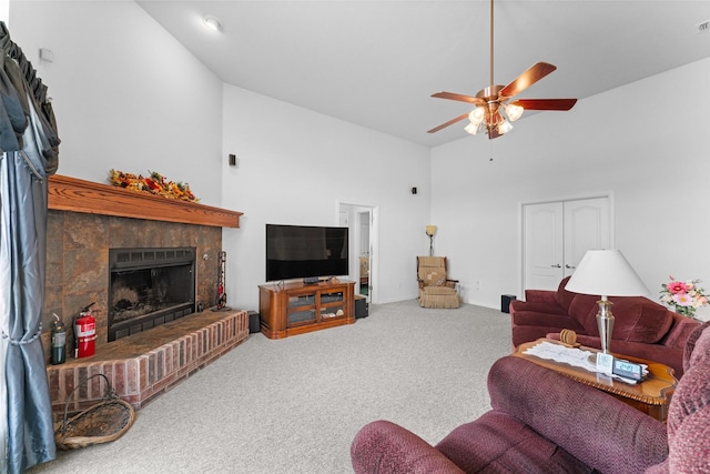 1114 Mount Ln, Rhome, TX 76078 - living room with high vaulted ceiling, carpet, ceiling fan, and a tile fireplace