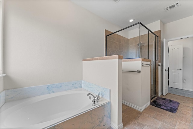 1114 Mount Ln, Rhome, TX 76078 - full bathroom featuring a garden tub, a shower stall, baseboards, and stone finish flooring