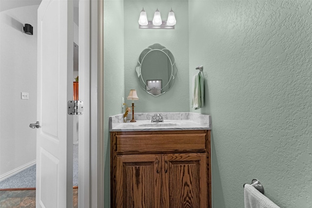 1114 Mount Ln, Rhome, TX 76078 - bathroom featuring vanity, a textured wall, radiator, and baseboards