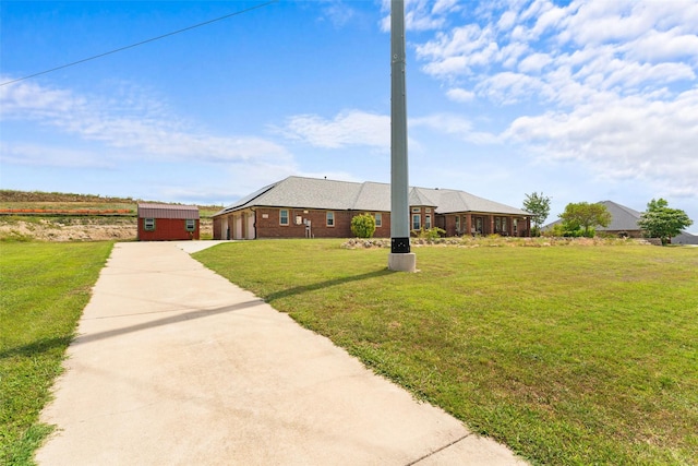 1114 Mount Ln, Rhome, TX 76078 - single story home with concrete driveway, a garage, a front yard, and brick siding