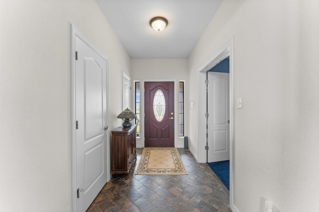 1114 Mount Ln, Rhome, TX 76078 - foyer entrance with stone tile floors and baseboards