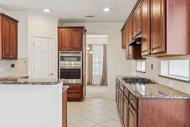 5723 Green Hollow Ln, The Colony, TX 75056 - kitchen with appliances with stainless steel finishes, stone countertops, backsplash, light tile patterned floors, and ornamental molding