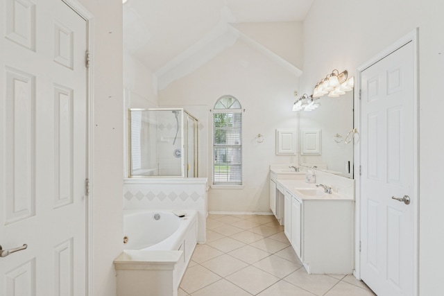 5723 Green Hollow Ln, The Colony, TX 75056 - bathroom featuring a stall shower, tile patterned floors, lofted ceiling, a bath, and double vanity