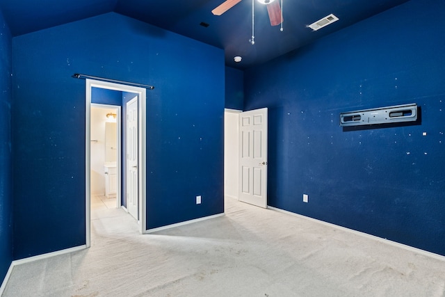 5723 Green Hollow Ln, The Colony, TX 75056 - unfurnished bedroom featuring carpet flooring, lofted ceiling, baseboards, and ensuite bath