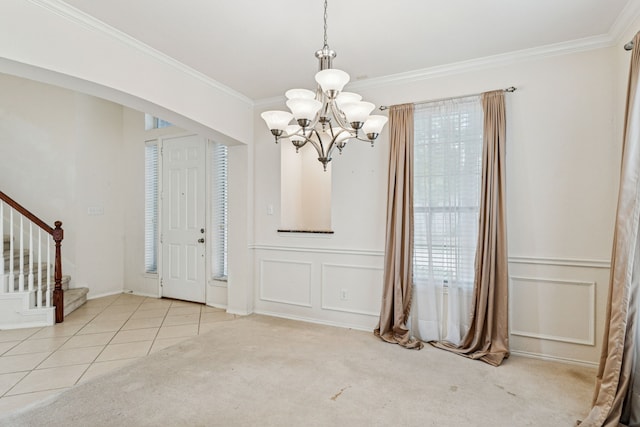 5723 Green Hollow Ln, The Colony, TX 75056 - unfurnished dining area featuring a chandelier, crown molding, stairs, a decorative wall, and carpet