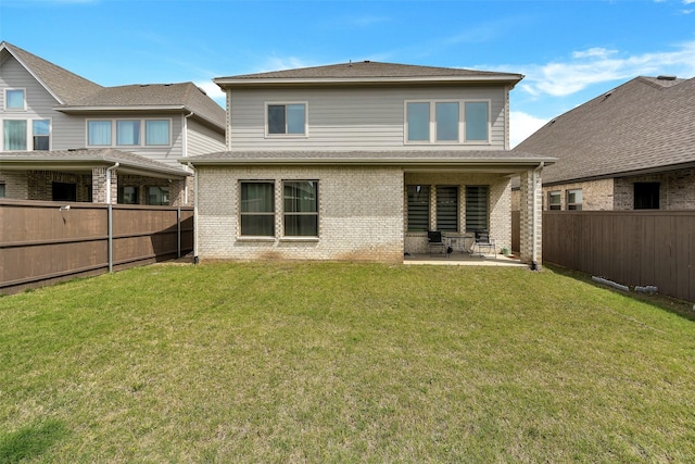 6329 Camey Place Way, The Colony, TX 75056 - back of house featuring brick siding and a patio area
