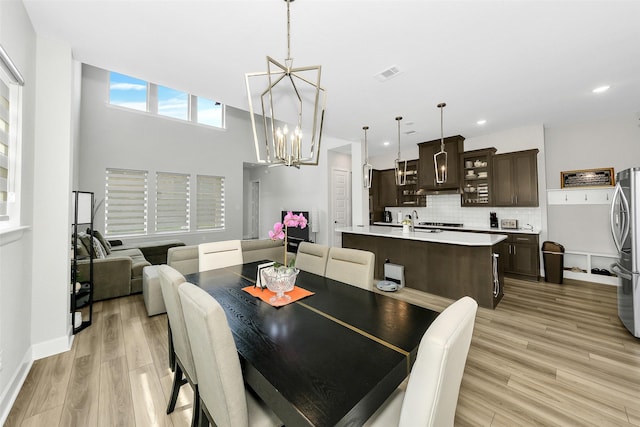 6329 Camey Place Way, The Colony, TX 75056 - dining area with a chandelier, light wood-style flooring, recessed lighting, and baseboards