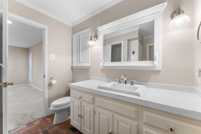 310 Northview Dr, Richardson, TX 75080 - bathroom with brick floors, toilet, vanity, crown molding, and baseboards