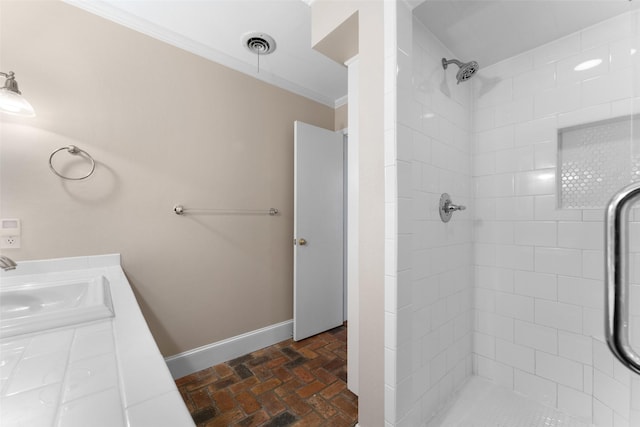 310 Northview Dr, Richardson, TX 75080 - full bath featuring ornamental molding, brick flooring, baseboards, tiled shower, and vanity