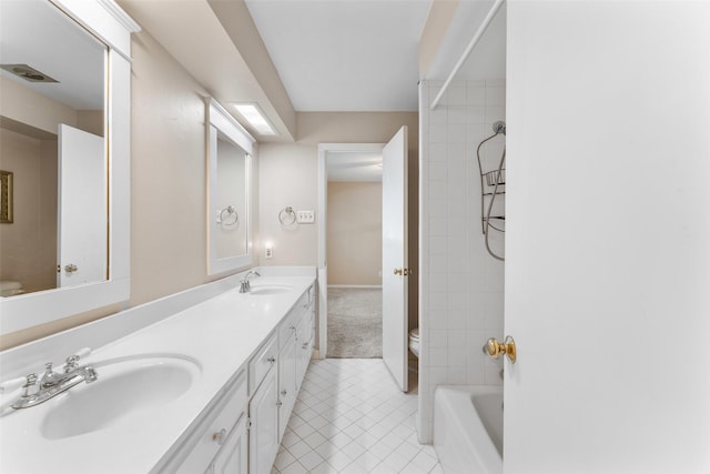 310 Northview Dr, Richardson, TX 75080 - bathroom featuring toilet, double vanity, tile patterned flooring, and bathing tub / shower combination
