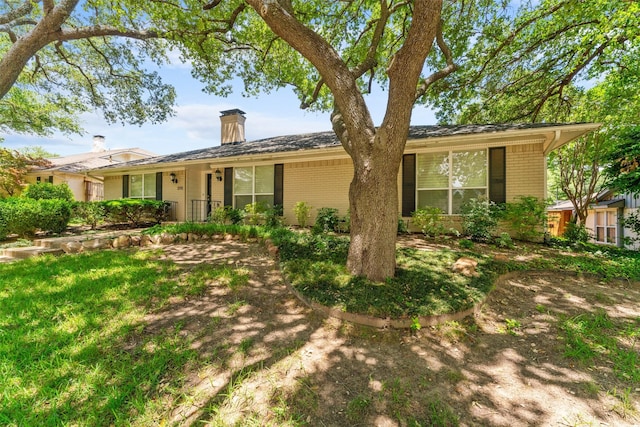 310 Northview Dr, Richardson, TX 75080 - ranch-style home with brick siding and a chimney