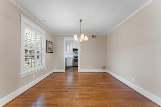 310 Northview Dr, Richardson, TX 75080 - unfurnished dining area with a chandelier, ornamental molding, wood finished floors, and baseboards