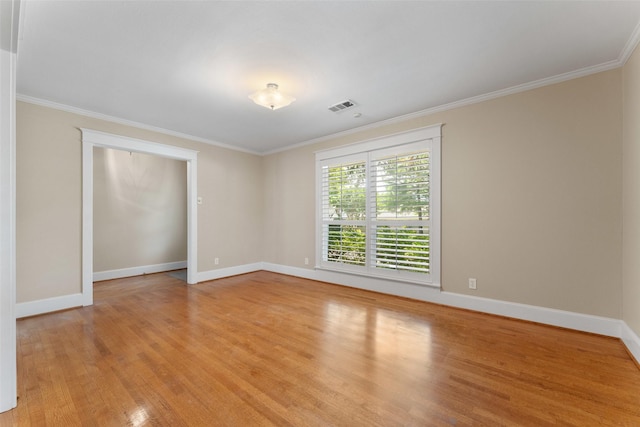 310 Northview Dr, Richardson, TX 75080 - spare room featuring light wood-type flooring, ornamental molding, and baseboards