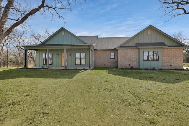 230 Silver Lakes Dr, Sunset, TX 76270 - view of front facade featuring board and batten siding, a front lawn, a porch, brick siding, and a shingled roof
