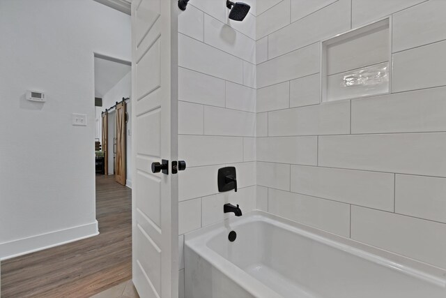 230 Silver Lakes Dr, Sunset, TX 76270 - bathroom featuring wood finished floors, baseboards, and bathtub / shower combination