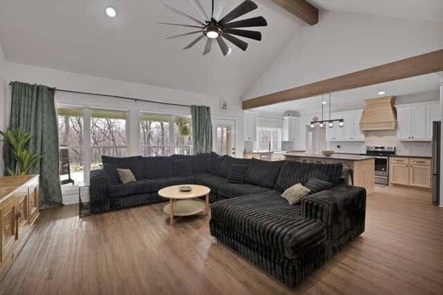230 Silver Lakes Dr, Sunset, TX 76270 - living room with ceiling fan, beamed ceiling, wood finished floors, high vaulted ceiling, and recessed lighting