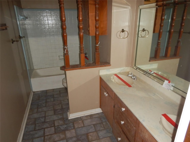 9217 Rhett Cir, Shreveport, LA 71118 - bathroom with baseboards, vanity, toilet, brick patterned floors, and bathing tub / shower combination